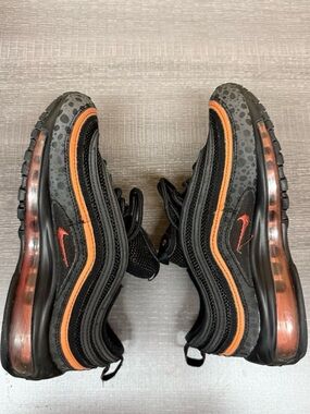 Nike Black Sneakers with Orange Trim and Speckle Detail